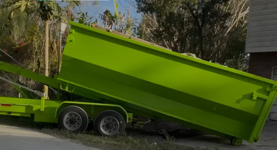 Green roll-off dumpster placed on a Longview, TX driveway